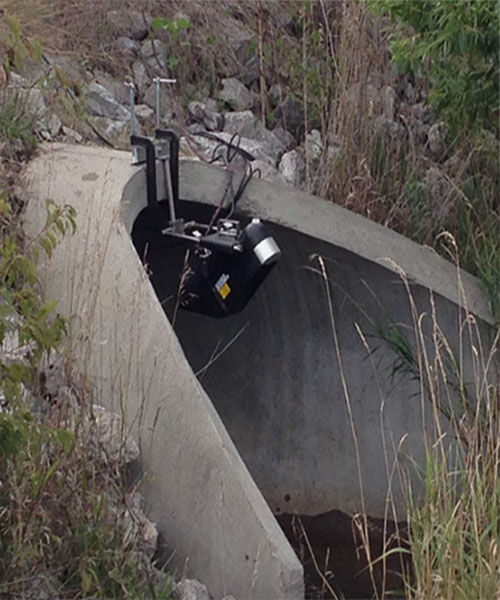 Storm water monitoring with a non-contact flow meter